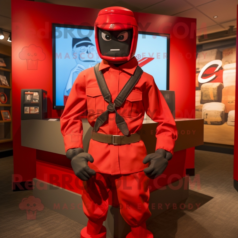 Red Gi Joe mascot costume character dressed with a Oxford Shirt and Bow ties Red Gi Joe mascot costume character dressed with a Oxford Shirt and Bow ties