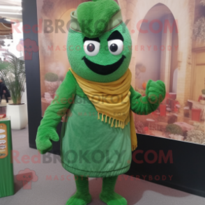 Green Biryani mascot costume character dressed with a Corduroy Pants and Brooches