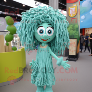 Turquoise Pesto Pasta mascot costume character dressed with a Playsuit and Hairpins