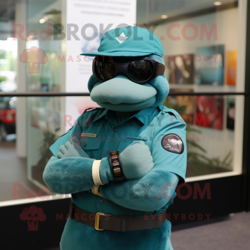 Teal Marine Recon mascot costume character dressed with a Polo Shirt and Bracelet watches