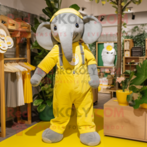 Lemon Yellow Elephant mascot costume character dressed with a Dungarees and Belts