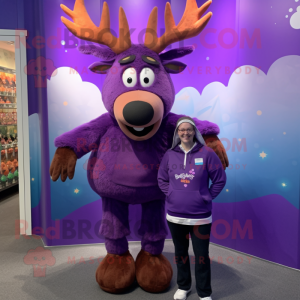 Purple Reindeer mascot costume character dressed with a Graphic Tee and Earrings