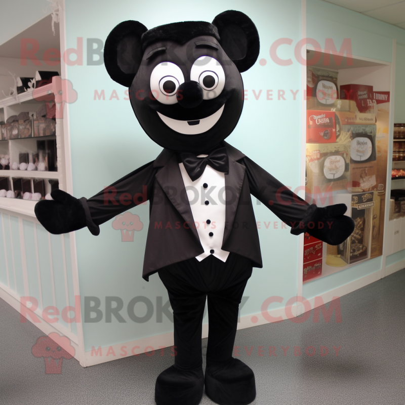 Black Candy Box mascot costume character dressed with a Henley Shirt and Bow ties Black Candy Box mascot costume character dressed with a Henley Shirt and Bow ties