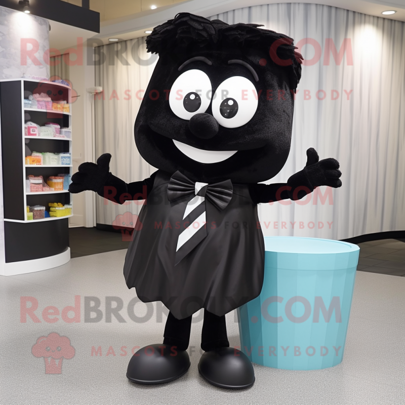 Black Candy Box mascot costume character dressed with a Henley Shirt and Bow ties Black Candy Box mascot costume character dressed with a Henley Shirt and Bow ties