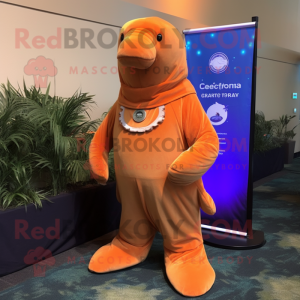 Orange Stellar'S Sea Cow mascot costume character dressed with a Cover-up and Tie pins