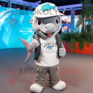 Gray Dolphin mascot costume character dressed with a Vest and Rings