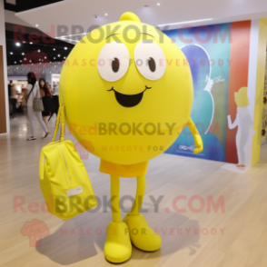 Lemon Yellow Volleyball Ball mascot costume character dressed with a Jeggings and Tote bags