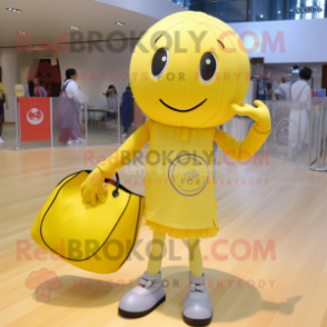 Lemon Yellow Volleyball Ball mascot costume character dressed with a Jeggings and Tote bags
