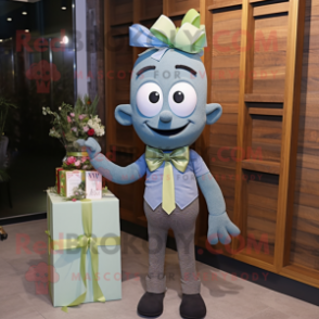 Olive Wedding Cake mascot costume character dressed with a Denim Shirt and Bow ties
