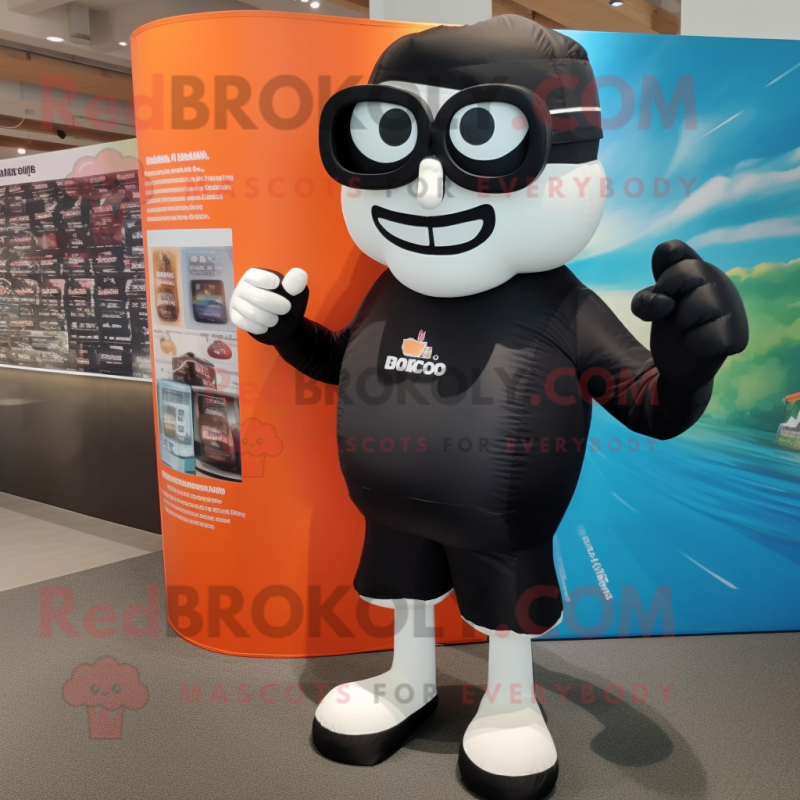 Black Boxing Glove mascot costume character dressed with a Board Shorts and Reading glasses