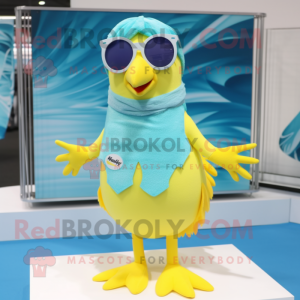 Cyan Canary mascot costume character dressed with a Swimwear and Sunglasses