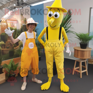 Yellow Stilt Walker mascot costume character dressed with a Dungarees and Pocket squares