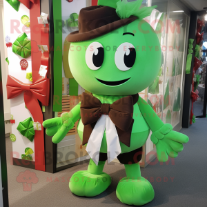 Green Chocolates mascot costume character dressed with a Romper and Bow ties