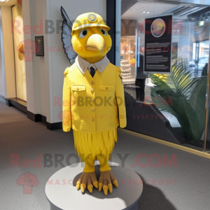 Lemon Yellow Haast'S Eagle mascot costume character dressed with a Sheath Dress and Berets