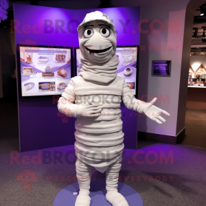 Lavender Mummy mascot costume character dressed with a T-Shirt and Lapel pins