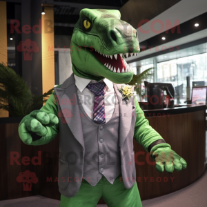 Green Tyrannosaurus mascot costume character dressed with a Suit Jacket and Tie pins