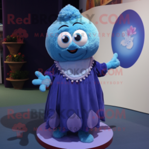 Blue Plum mascot costume character dressed with a Playsuit and Shawl pins