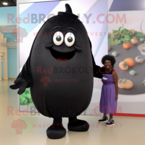 Black Potato mascot costume character dressed with a Romper and Cummerbunds