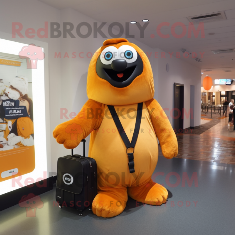 Orange Giant Sloth mascot costume character dressed with a Tuxedo and Messenger bags