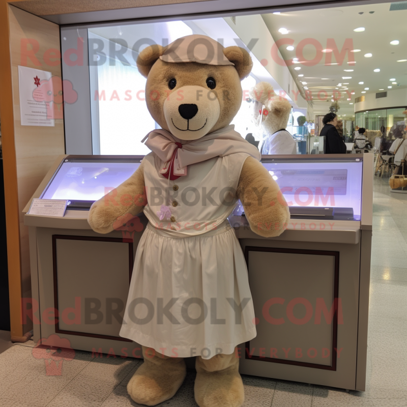 Beige Teddy Bear mascot costume character dressed with a A-Line Skirt and Shawls Beige Teddy Bear mascot costume character dressed with a A-Line Skirt and Shawls