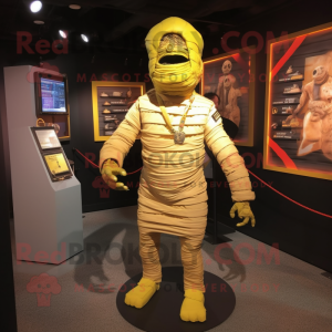 Yellow Mummy mascot costume character dressed with a Romper and Tie pins