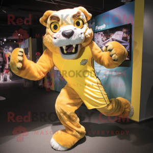 Yellow Smilodon mascot costume character dressed with a Running Shorts and Tie pins