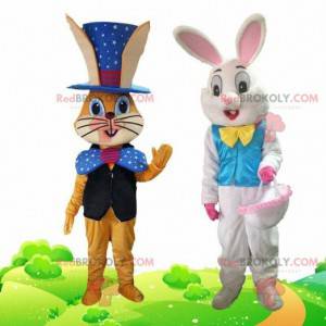 2 mascotte di coniglio vestite con abiti festivi -