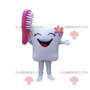 Lachende tand mascotte met een tandenborstel, tandarts kostuum