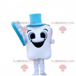 Mascotte dente sorridente con uno spazzolino da denti blu -