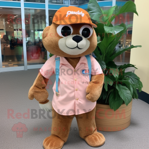 Peach Jaguarundi mascot costume character dressed with a Bermuda Shorts and Hat pins