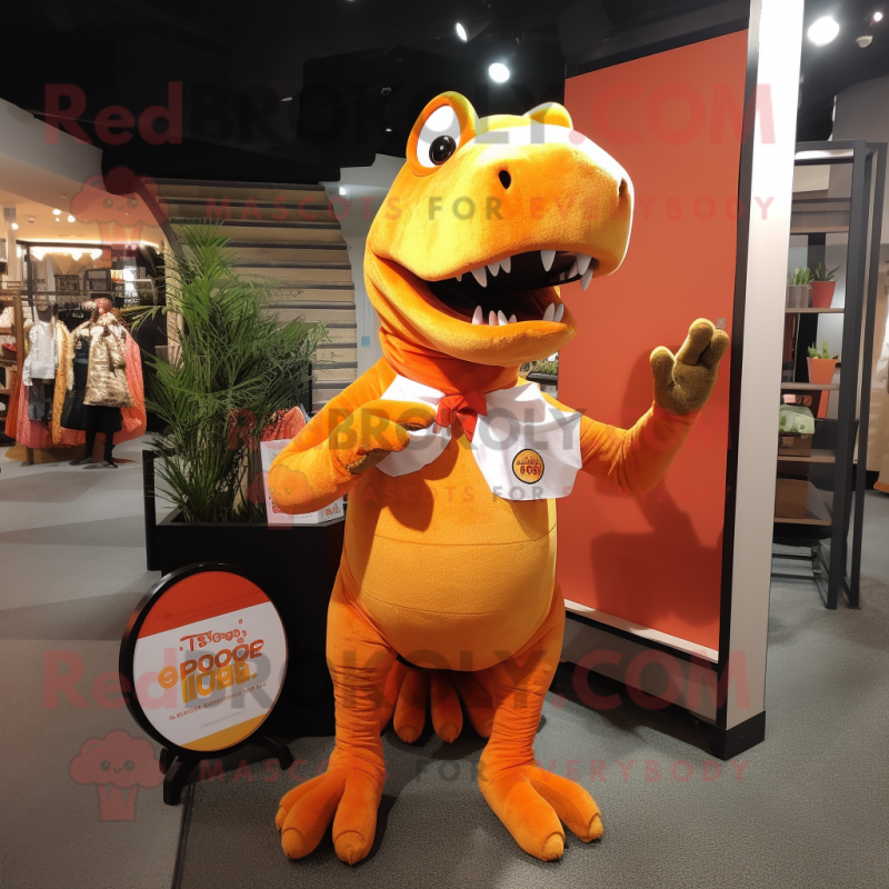 Orange T Rex mascot costume character dressed with a Trousers and Tote bags Orange T Rex mascot costume character dressed with a Trousers and Tote bags