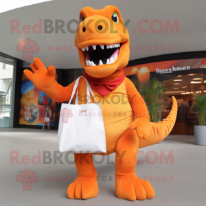 Orange T Rex mascot costume character dressed with a Trousers and Tote bags