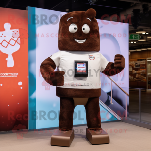 Brown Chocolate Bar mascot costume character dressed with a Polo Tee and Smartwatches