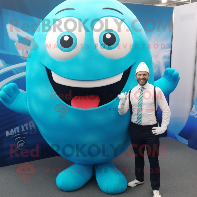 Cyan Rugby Ball mascot costume character dressed with a Suit Pants and Wraps Cyan Rugby Ball mascot costume character dressed with a Suit Pants and Wraps