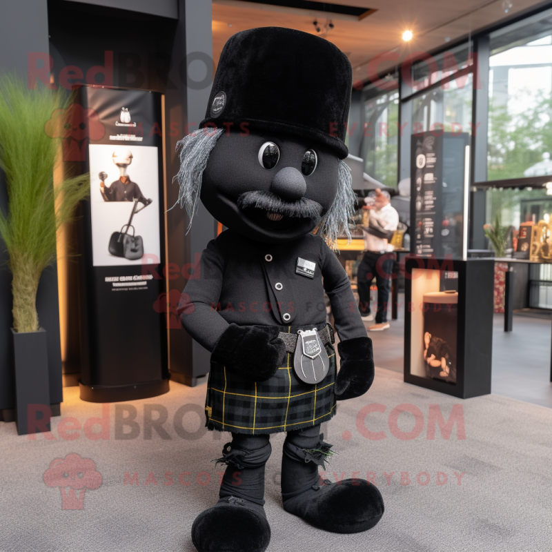 Black Bagpipe mascot costume character dressed with a T-Shirt and Hat pins Black Bagpipe mascot costume character dressed with a T-Shirt and Hat pins