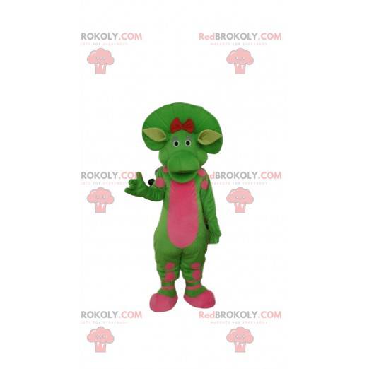 Green and pink dinosaur mascot, prehistoric costume -