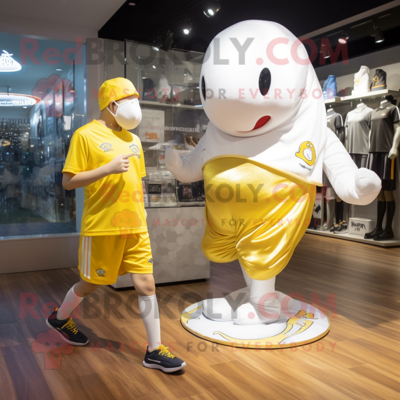 Gold Beluga Whale mascot costume character dressed with a Running Shorts and Anklets