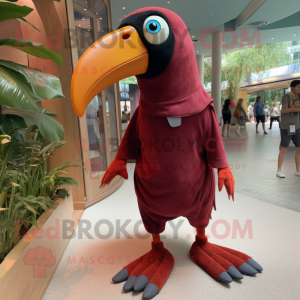 Maroon Toucan mascot costume character dressed with a Oxford Shirt and Foot pads