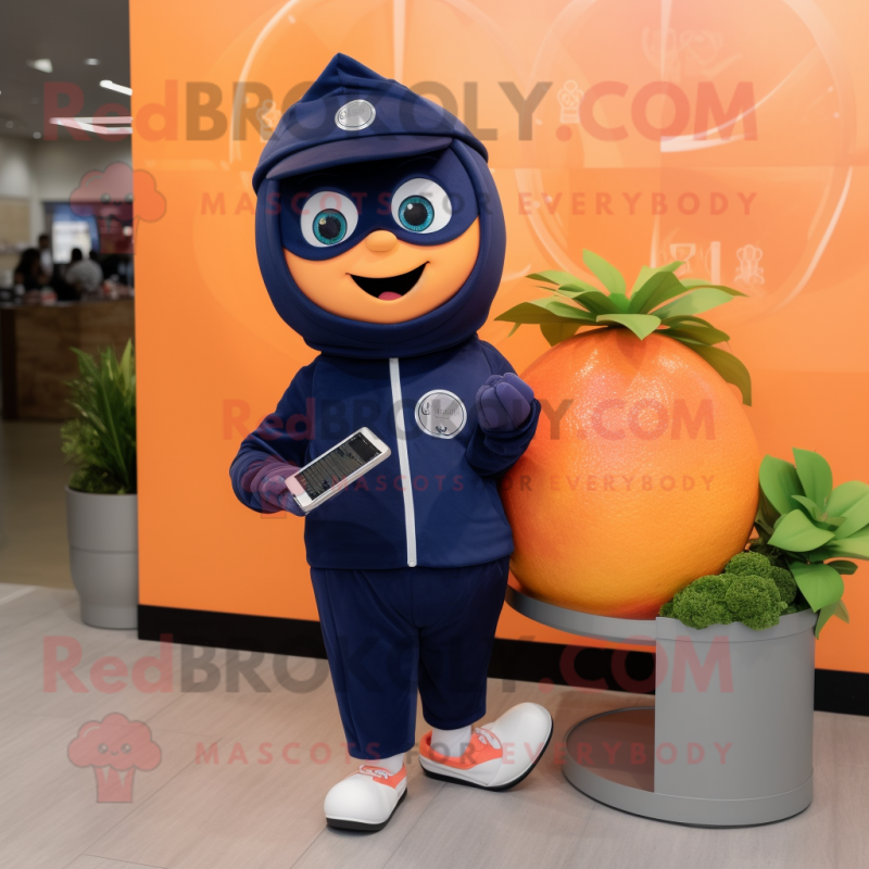 Navy Grapefruit mascot costume character dressed with a Hoodie and Digital watches