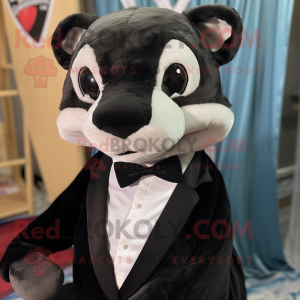 Black Weasel mascot costume character dressed with a Shift Dress and Bow ties