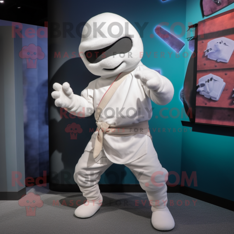 White Ninja mascot costume character dressed with a Bermuda Shorts and Cummerbunds White Ninja mascot costume character dressed with a Bermuda Shorts and Cummerbunds