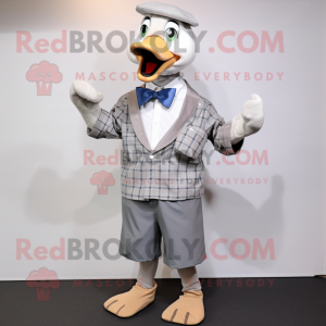 Silver Geese mascot costume character dressed with a Oxford Shirt and Cufflinks