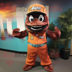 Rust Barracuda mascot costume character dressed with a Jumpsuit and Hat pins