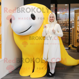 Yellow Beluga Whale mascot costume character dressed with a Wrap Skirt and Earrings