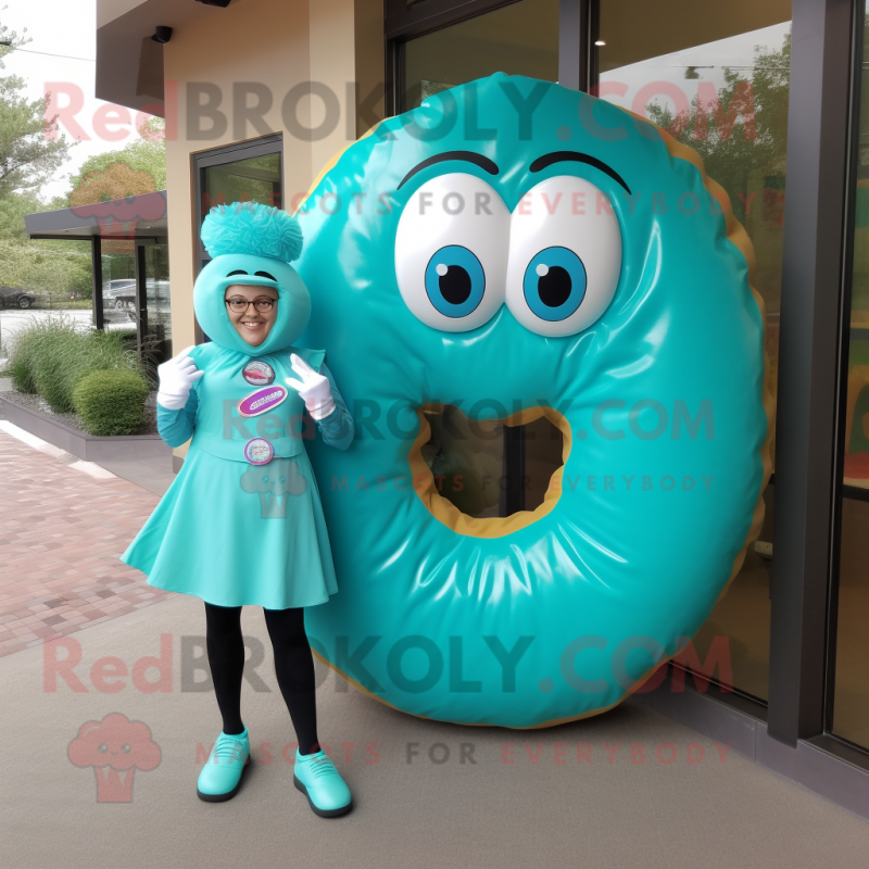 Turquoise Donut mascot costume character dressed with a Shift Dress and Shoe clips Turquoise Donut mascot costume character dressed with a Shift Dress and Shoe clips