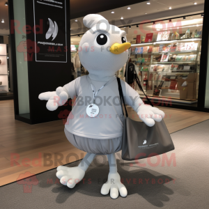 Silver Dove mascot costume character dressed with a Running Shorts and Tote bags