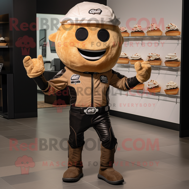 Tan Cupcake mascot costume character dressed with a Moto Jacket and Suspenders