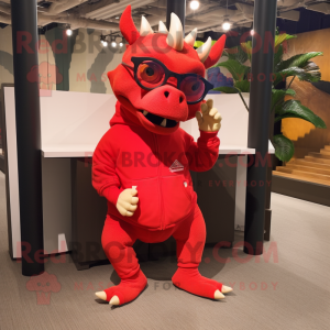 Red Triceratops mascot costume character dressed with a Sweatshirt and Eyeglasses