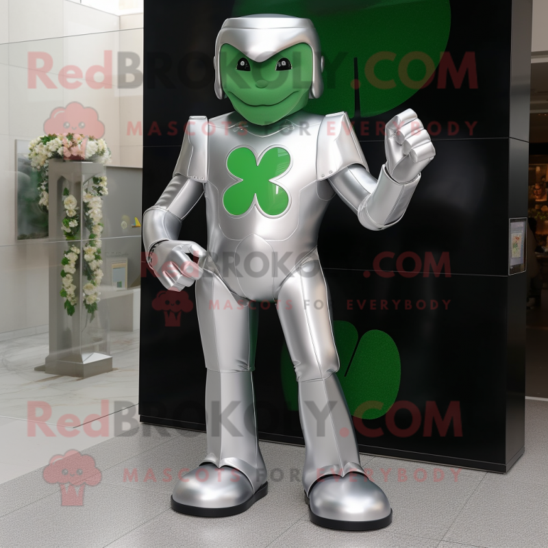 Silver Four Leaf Clover mascot costume character dressed with a Suit and Foot pads Silver Four Leaf Clover mascot costume character dressed with a Suit and Foot pads