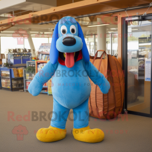 Blue Hot Dog mascot costume character dressed with a Corduroy Pants and Tote bags